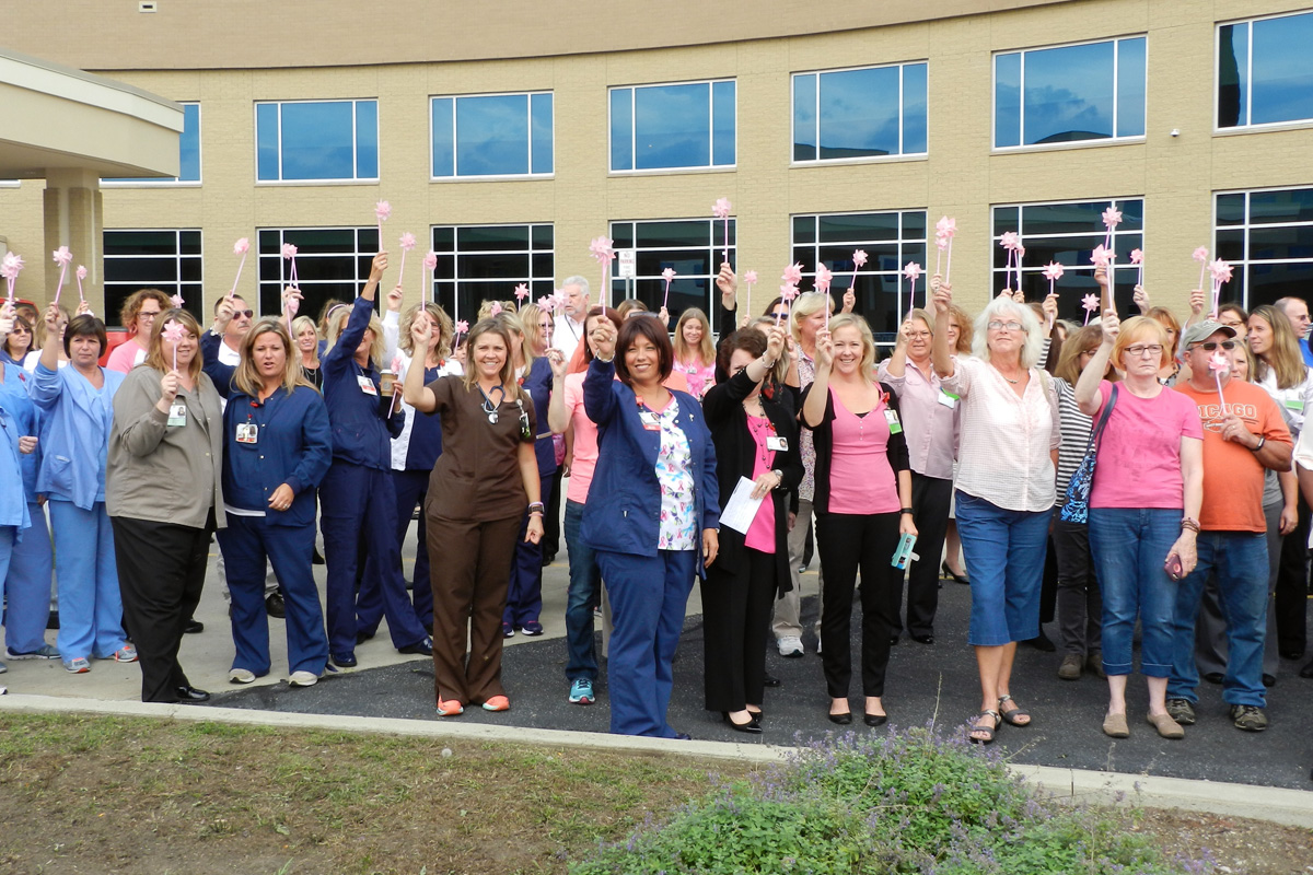 Breast Cancer Survivors Gather at Porter Regional Hospital to “Blow Away Breast Cancer” with Flag Raising