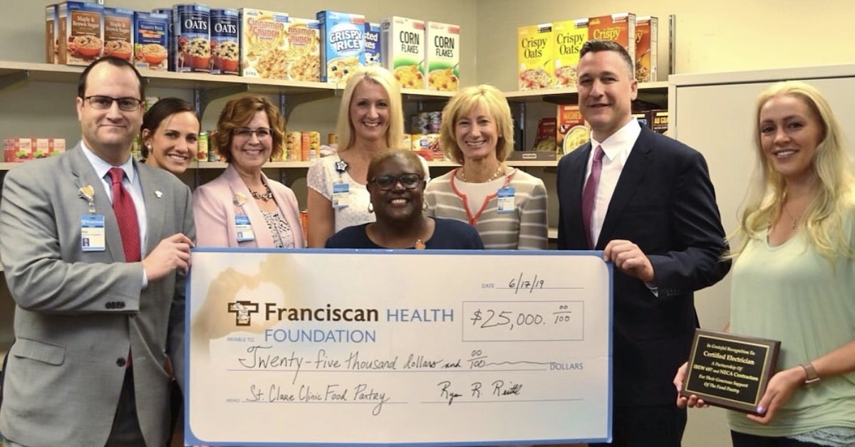 Shelves of St. Clare Health Clinic food pantry will remain stocked thanks to $25,000 donation from Certified Electrician